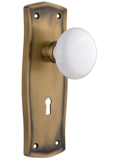 Prairie Style Door Set with White Porcelain Door Knobs in Antique Brass.